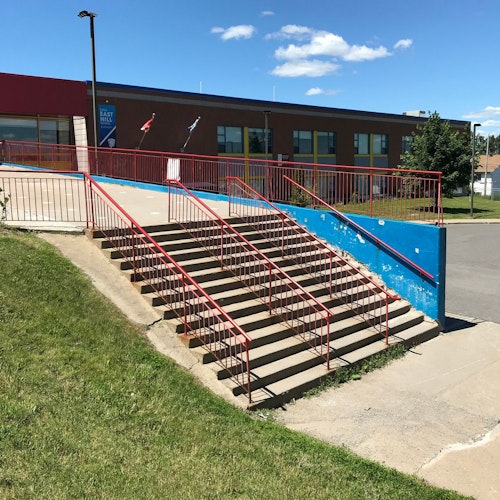 East Hill Elementary School - 14 Stair Rails skateboard spot in Montreal, Quebec
